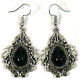 Boucles d'oreilles pendantes en metal argente cisele serties de pierres noir