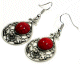Boucles d'oreilles pendantes en metal argente cisele serties de pierres bordeaux